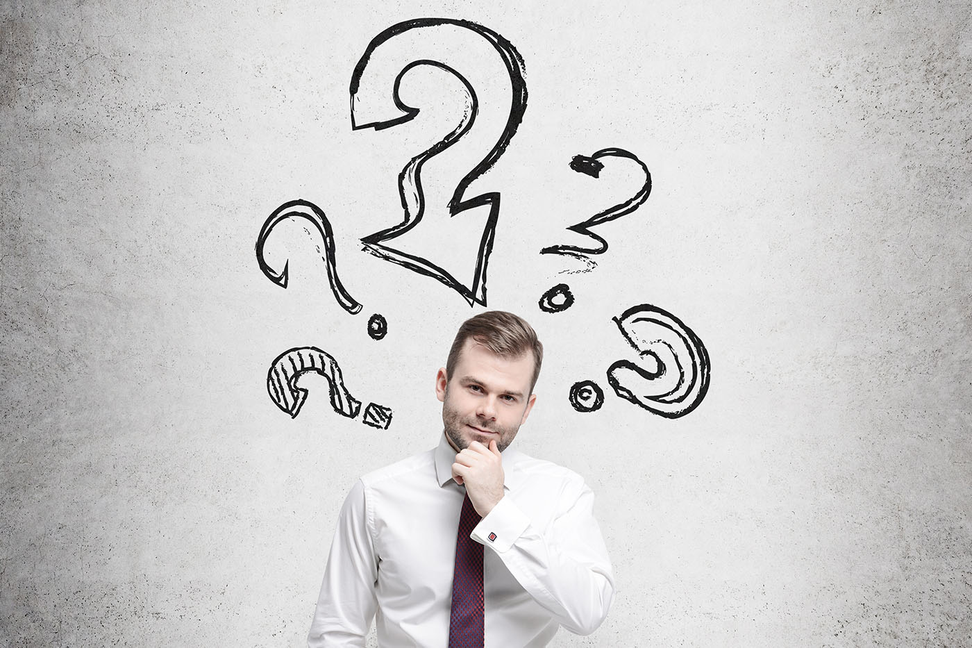 Young businessman is thinking about complicated questions.
